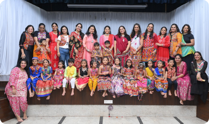 Parents, teachers and children together at a school celebration